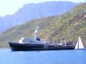 'SeaWolf' at anchor with their toy sailboat astern